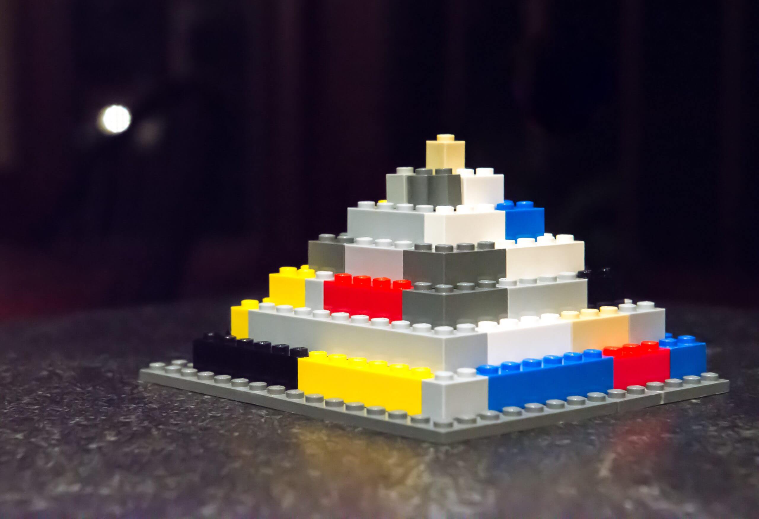 A pyramid made out of Legos.