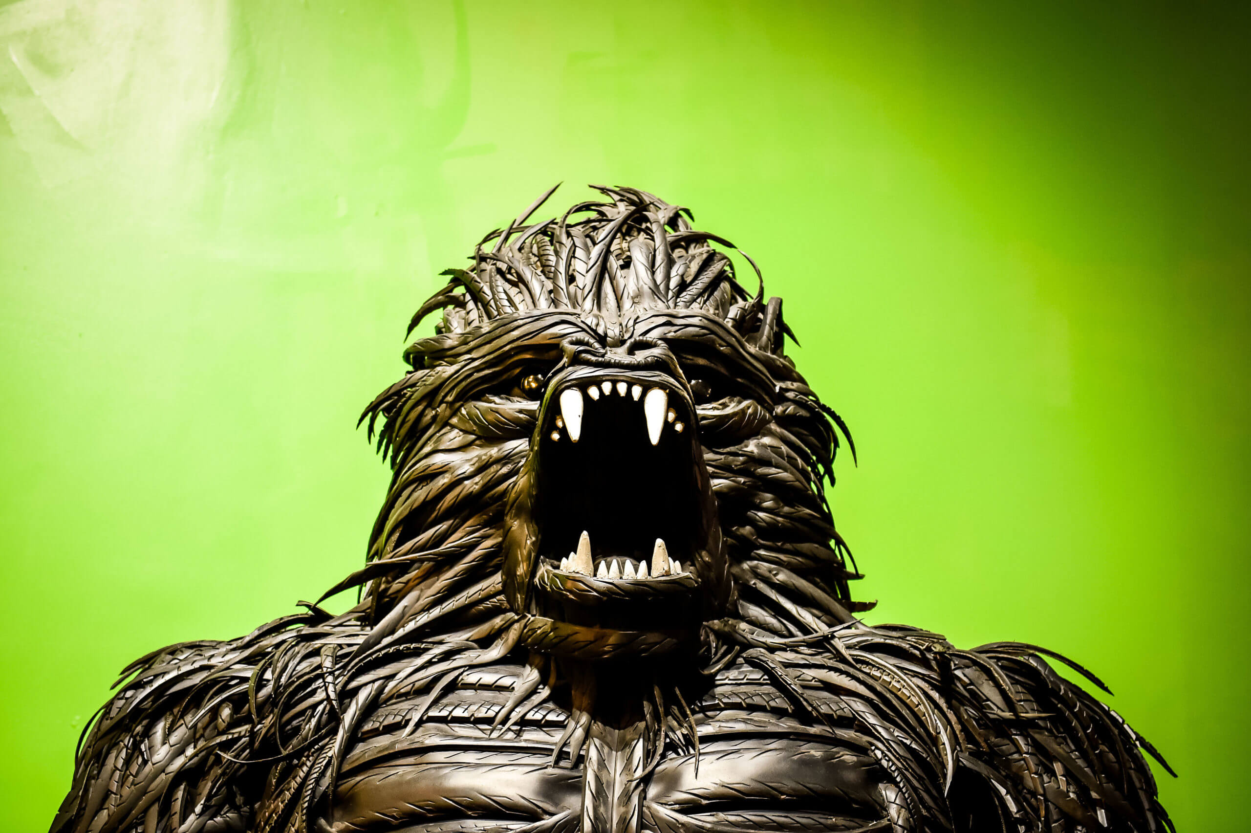 A view of a godzilla action figure shows the face with mouth open and teeth showing.