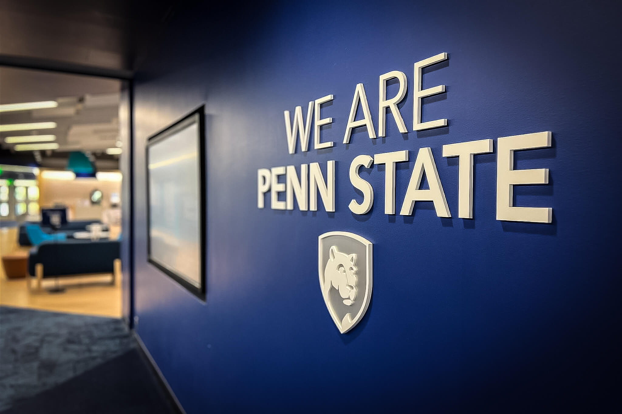 Color image of Penn State's admissions office "We Are Penn State" sign.